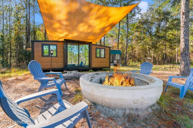a view of a lounge chair in the backyard of a house