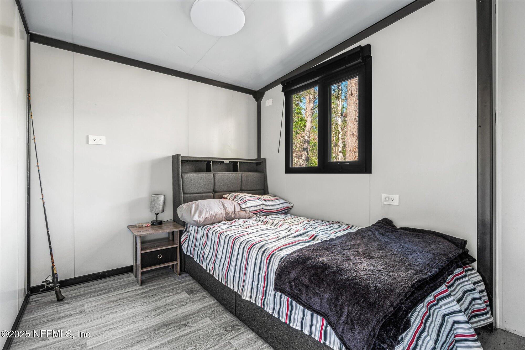 191 County Landfill Road Palatka, FL 32177 - Photo 13 of 37 a bedroom with a bed and window