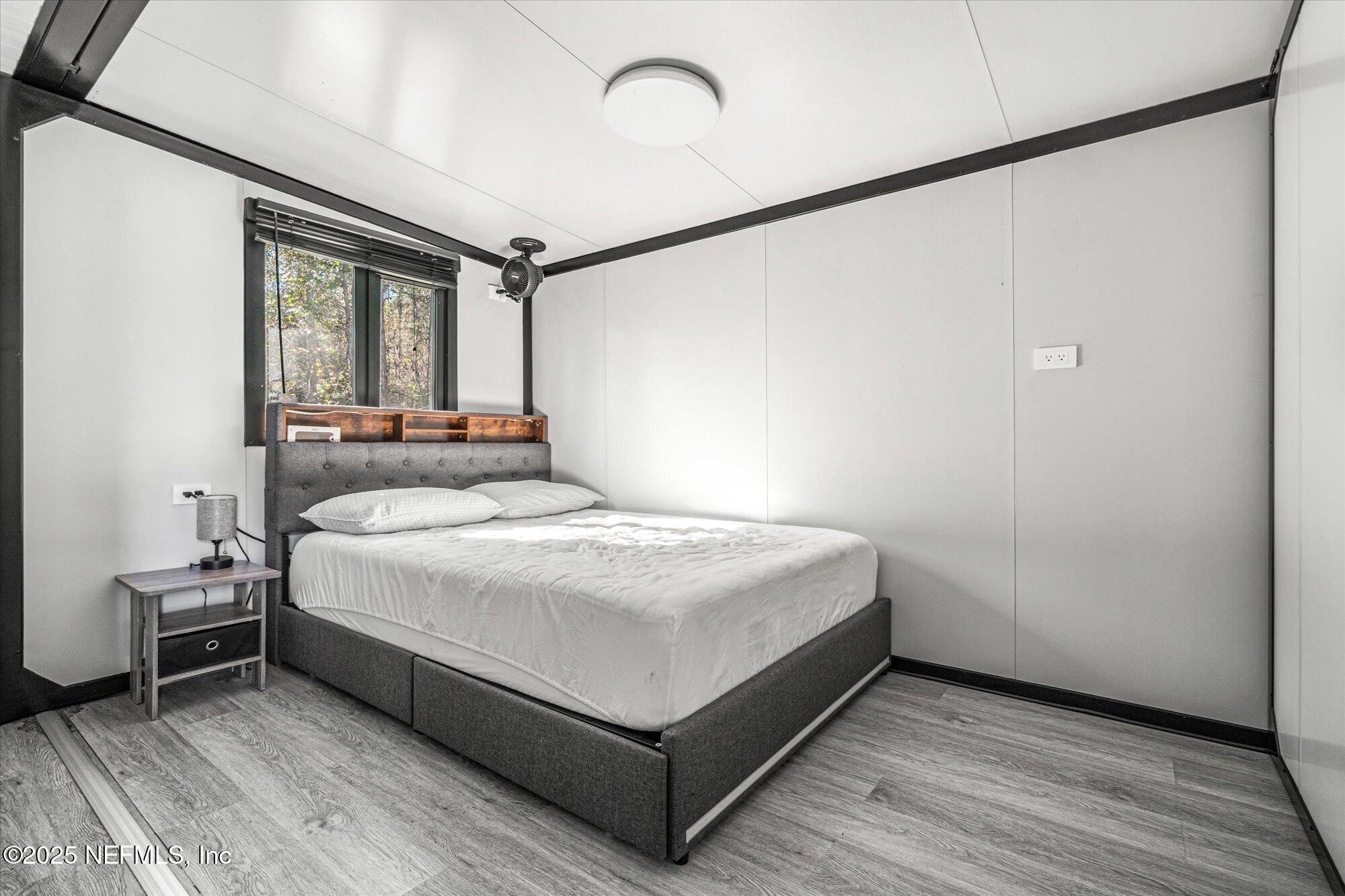 191 County Landfill Road Palatka, FL 32177 - Photo 14 of 37 a bedroom with a bed and a window