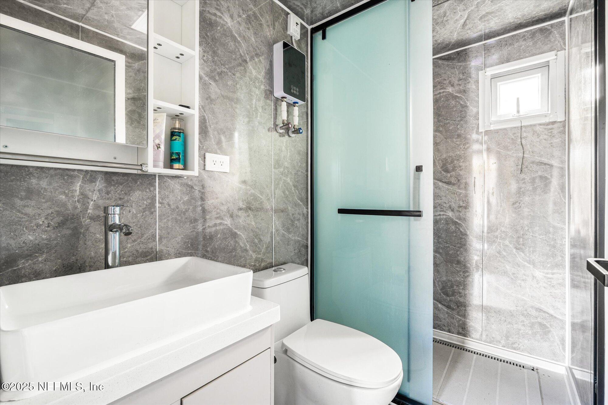 191 County Landfill Road Palatka, FL 32177 - Photo 15 of 37 a bathroom with a sink a toilet and shower