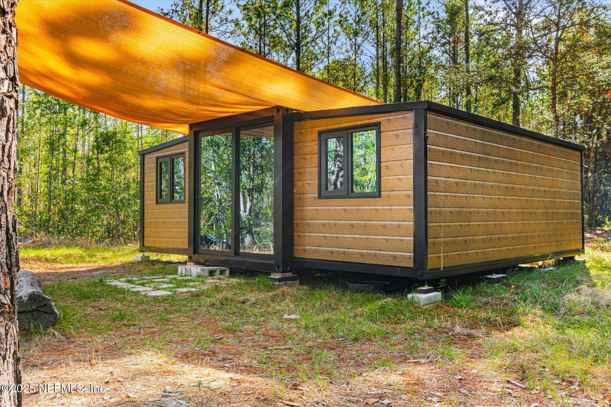 191 County Landfill Road Palatka, FL 32177 - Photo 18 of 37 a view of a house with a yard