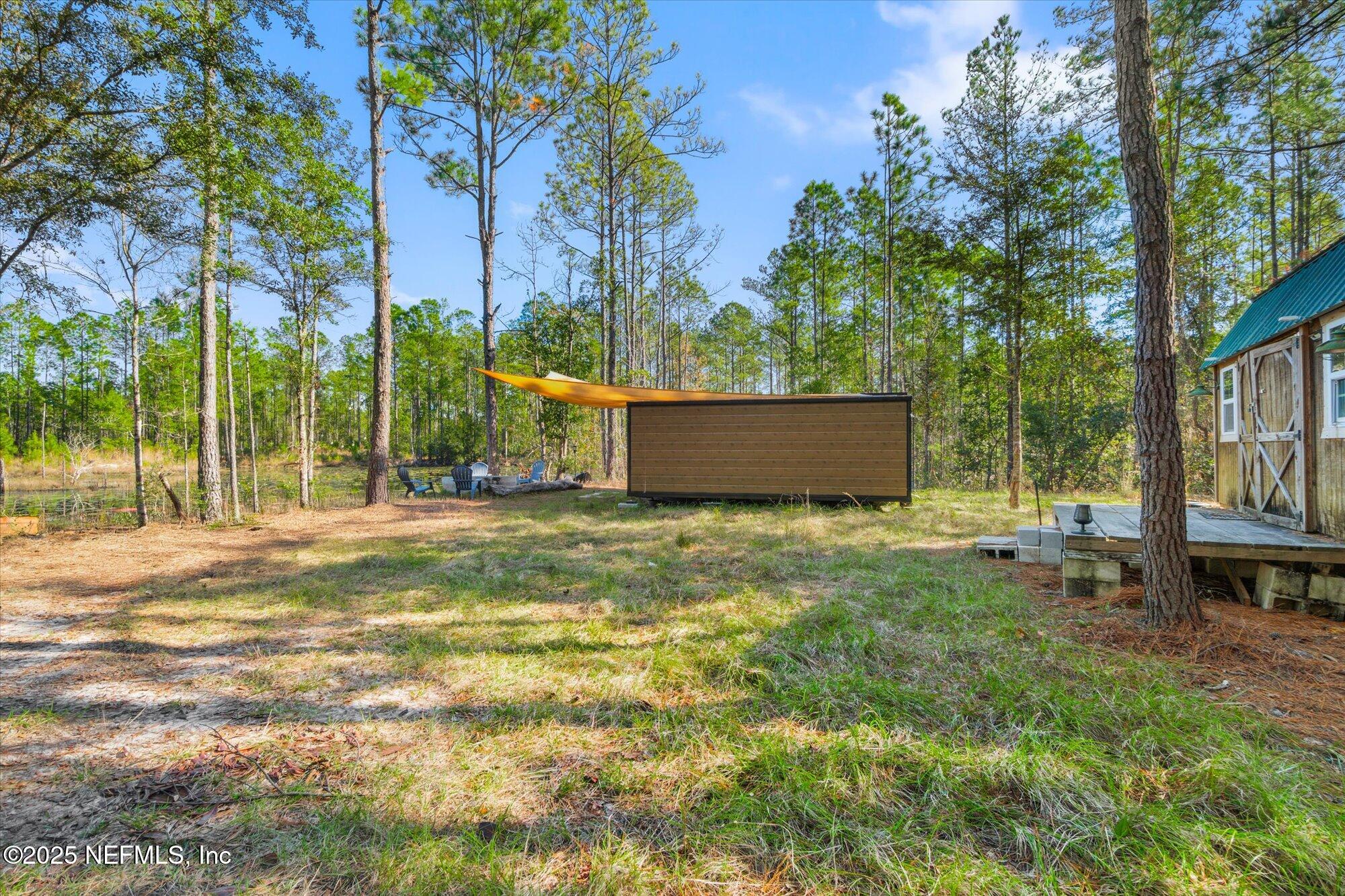 191 County Landfill Road Palatka, FL 32177 - Photo 20 of 37 a view of backyard of house with green space