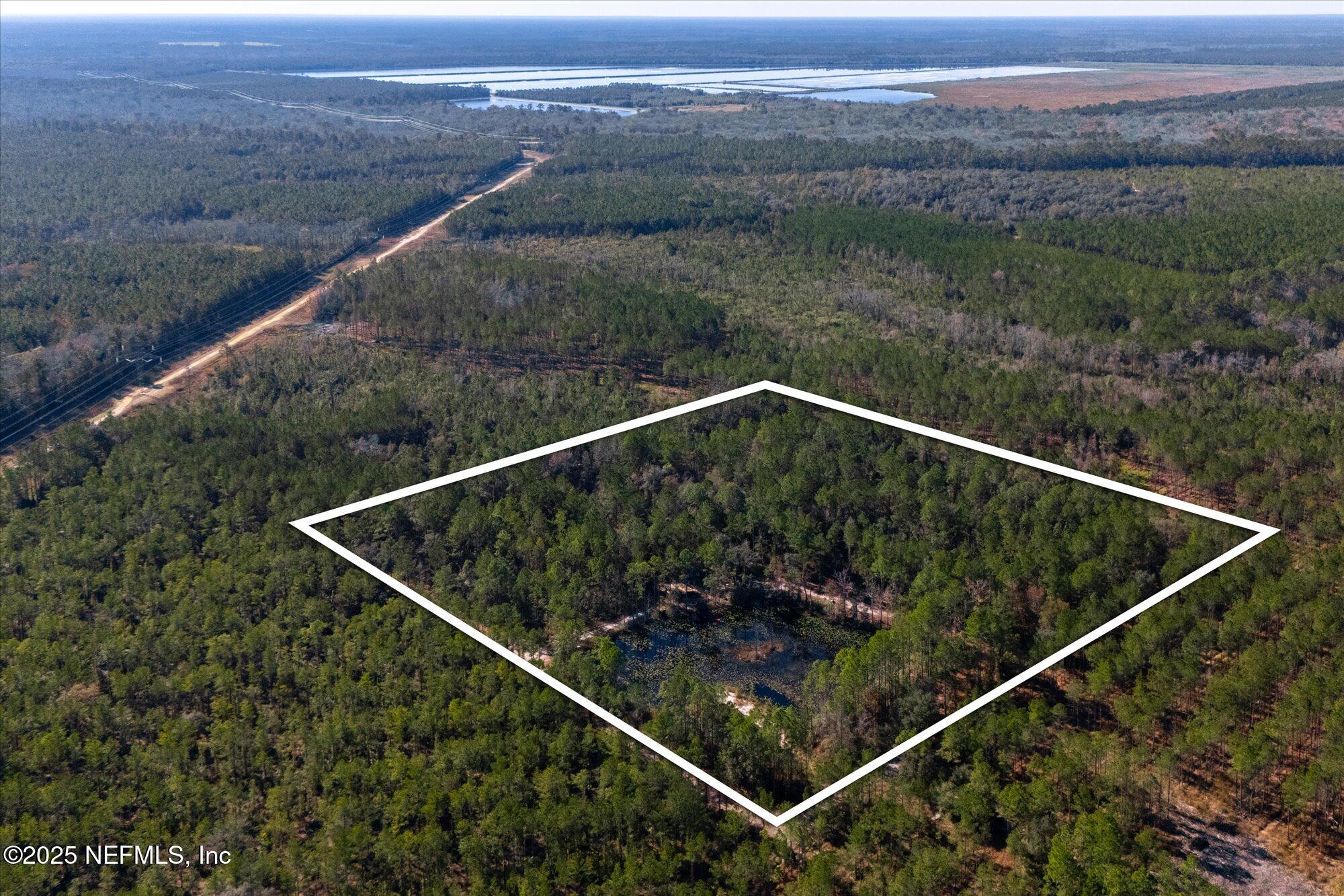 191 County Landfill Road Palatka, FL 32177 - Photo 24 of 37 a terrace with outdoor seating and lake view