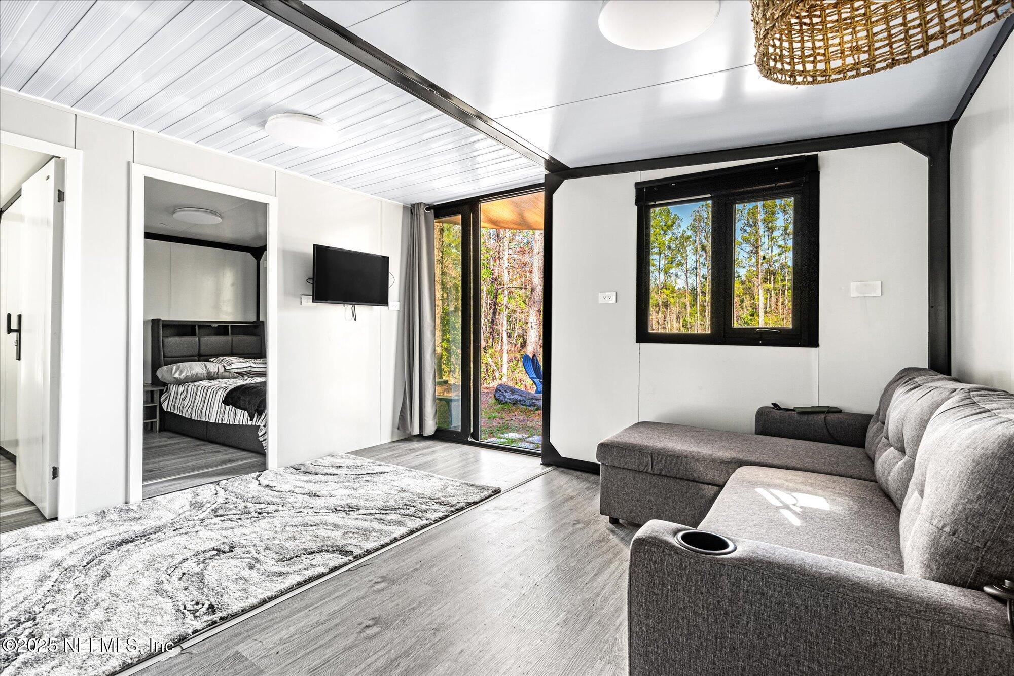 191 County Landfill Road Palatka, FL 32177 - Photo 8 of 37 a living room with furniture and a rug