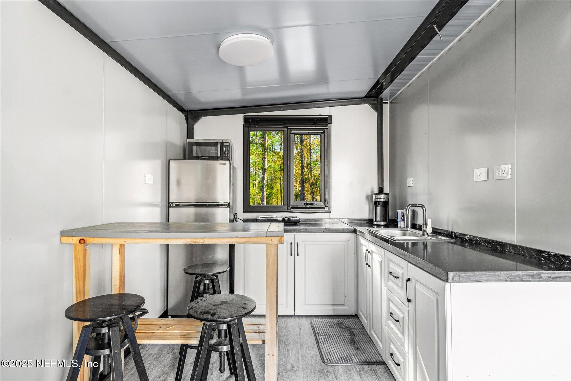 191 County Landfill Road Palatka, FL 32177 - Photo 10 of 37 a kitchen with a sink cabinets and window