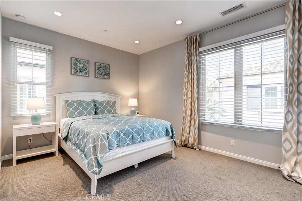 72 Cherry Tree Irvine, CA 92620 - Photo 12 of 15 a bed sitting in a bedroom next to a window