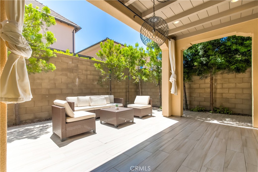 72 Cherry Tree Irvine, CA 92620 - Photo 14 of 15 a outdoor space with patio the couches and a dining table with garden view