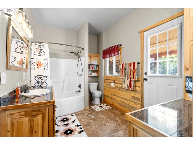 a kitchen with a refrigerator and a stove