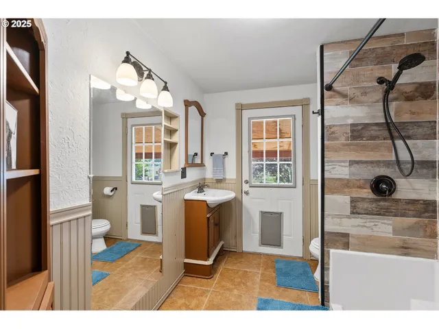 a open kitchen with sink and refrigerator