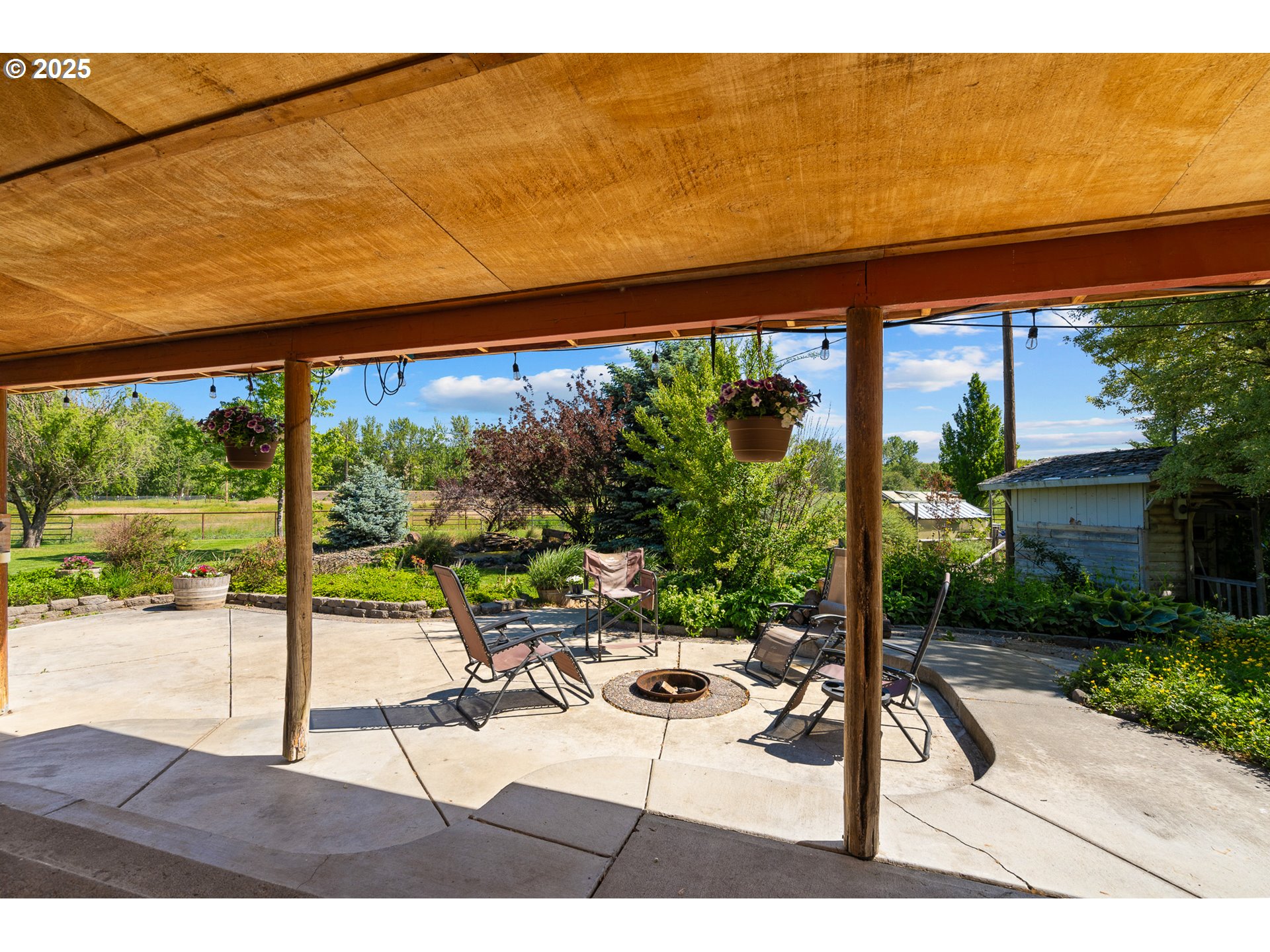 73594 Davis Lane Pendleton, OR 97801 - Photo 35 of 48 a view of a patio with a table and chairs under an umbrella