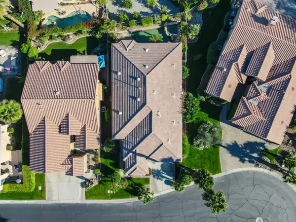 a view of a chairs and table in the patio