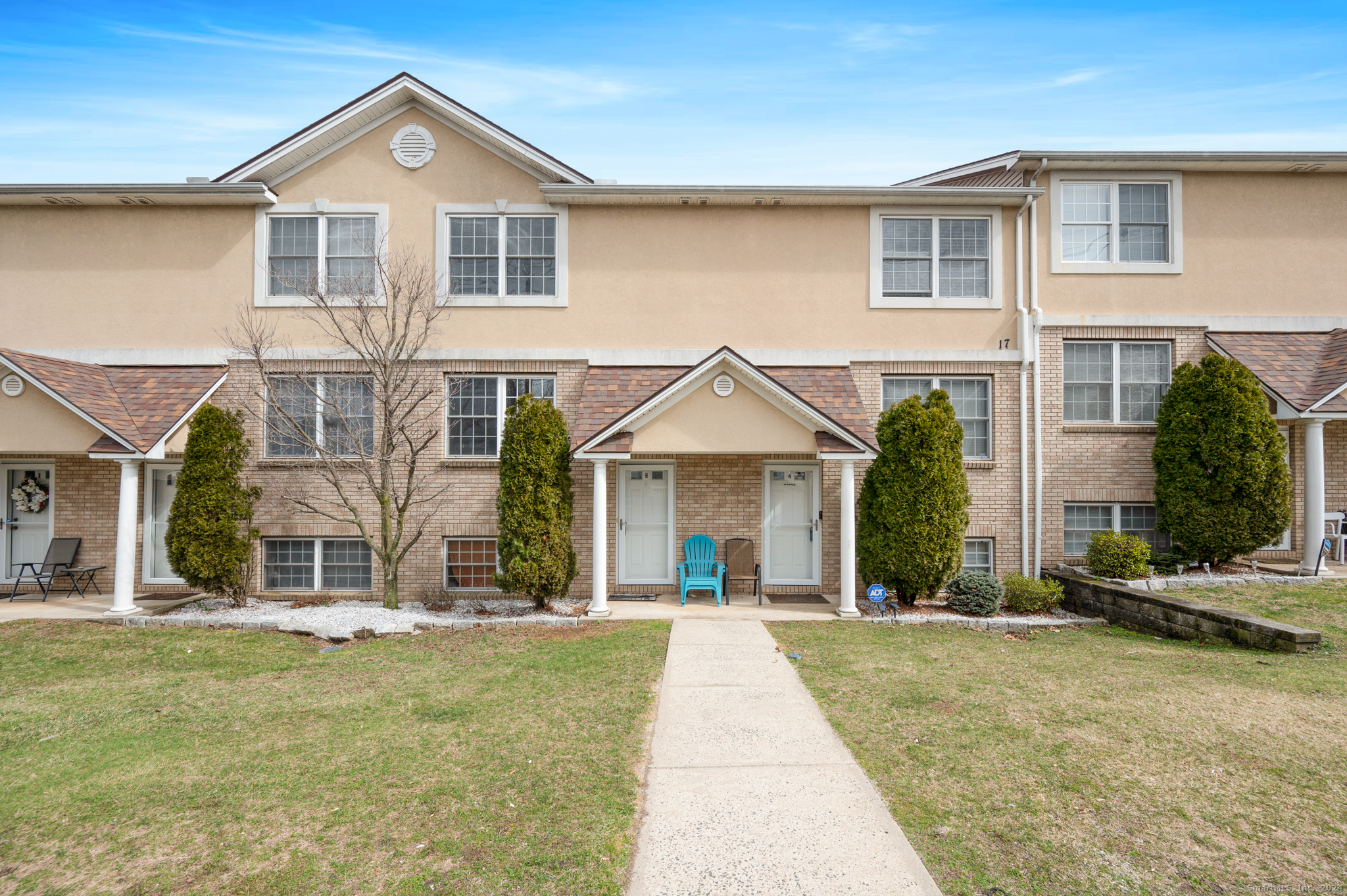 a front view of a house with a yard