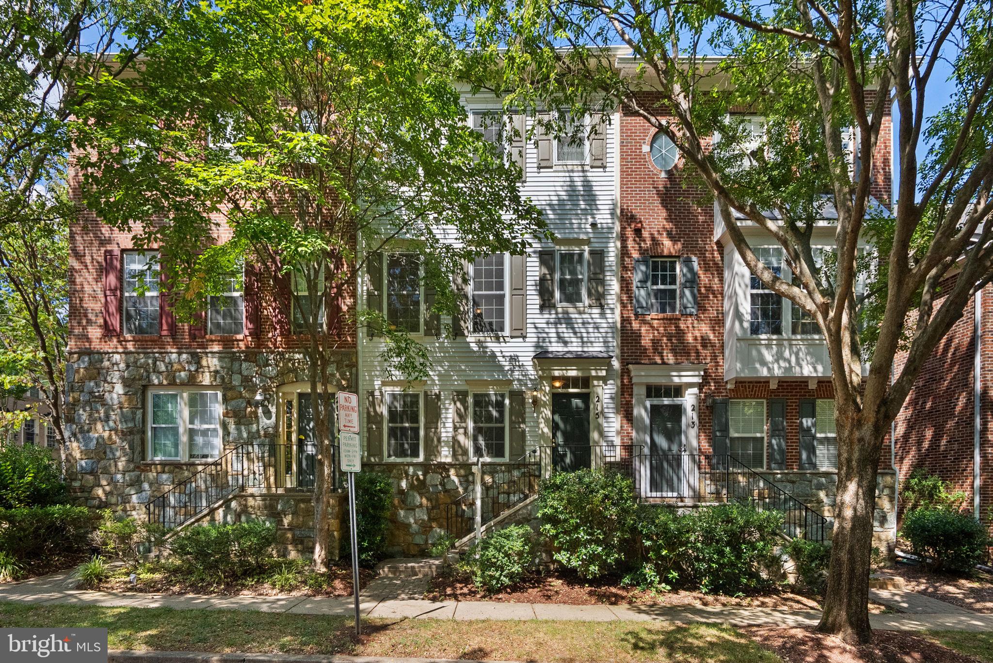 a view of a brick building next to a road