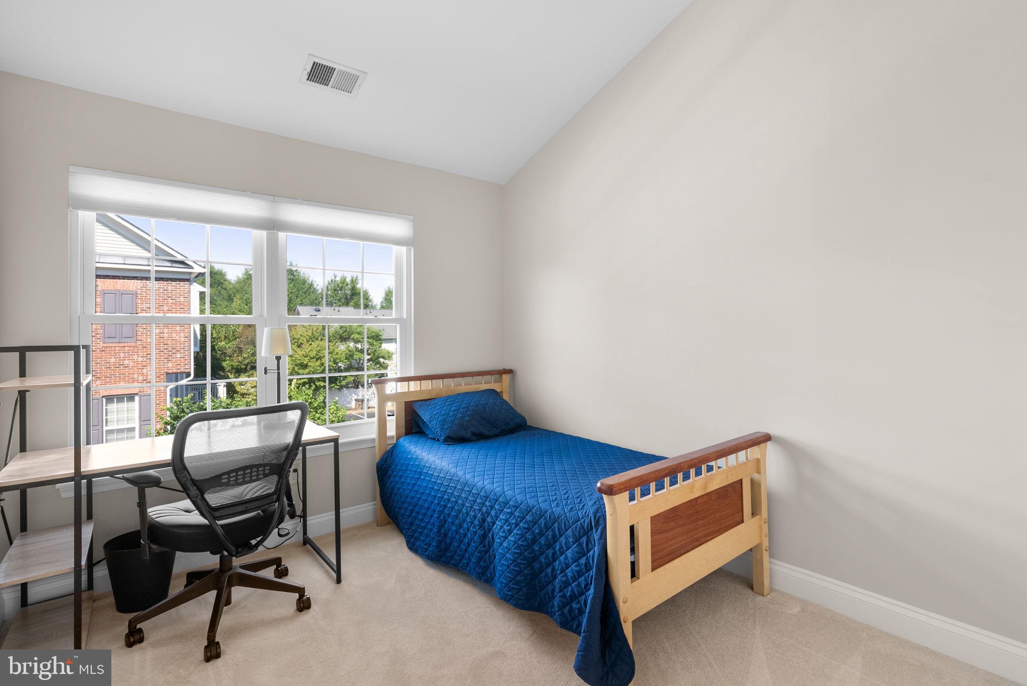 215 Poplar Spring Road Rockville, MD 20850 - Photo 18 of 30 a bedroom with a bed and a window