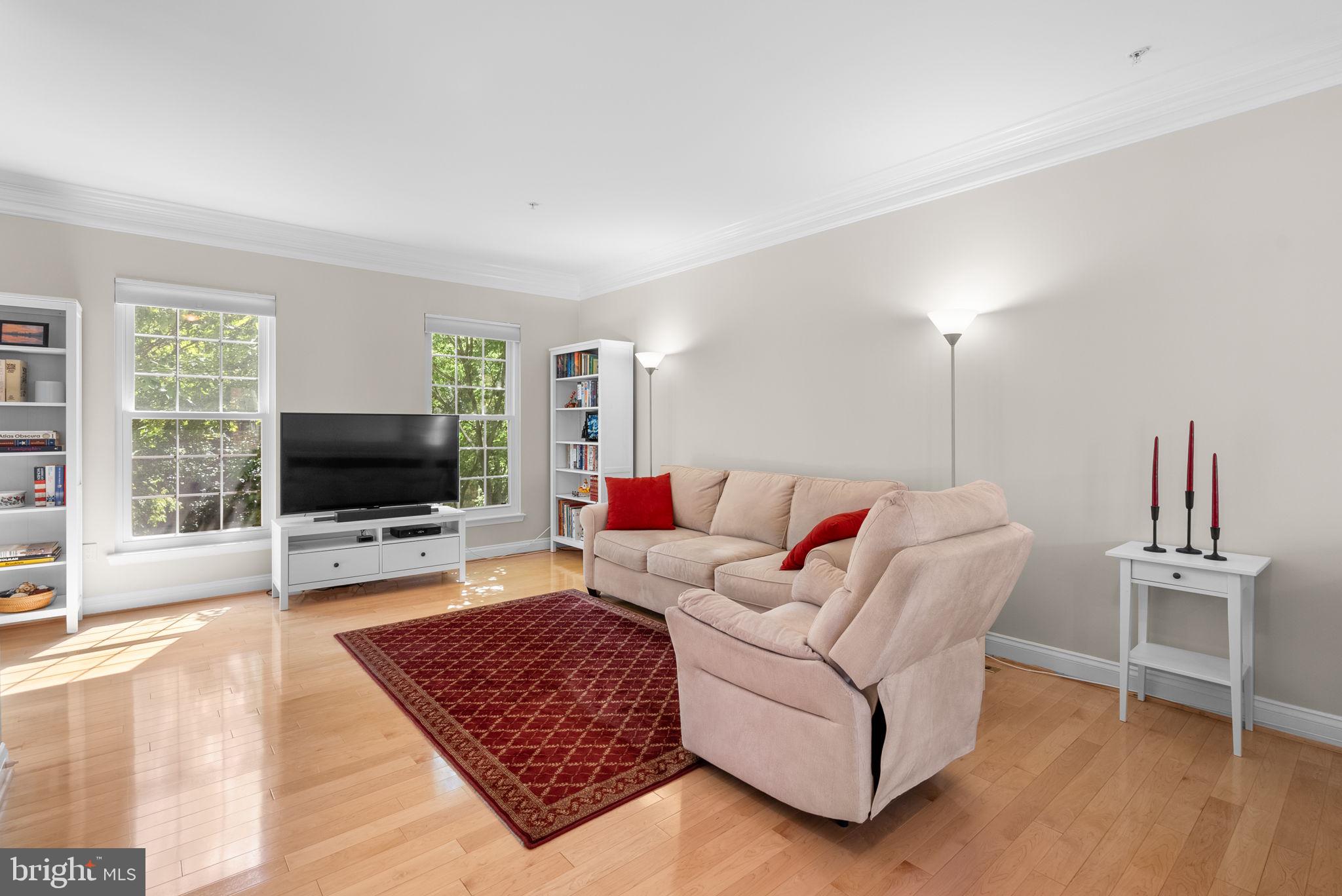 215 Poplar Spring Road Rockville, MD 20850 - Photo 2 of 30 a living room with furniture and a flat screen tv