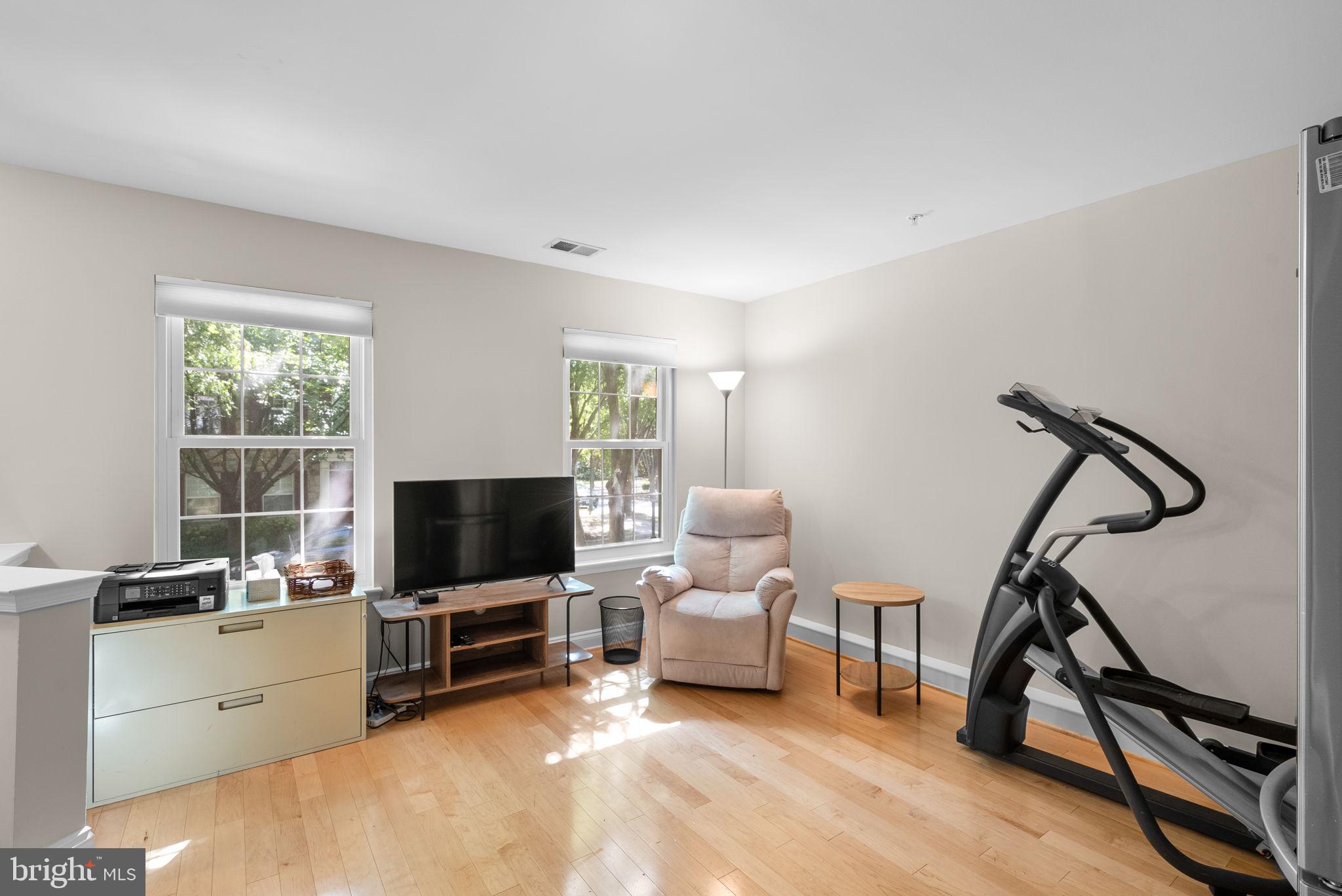 215 Poplar Spring Road Rockville, MD 20850 - Photo 24 of 30 a living room with furniture and a flat screen tv