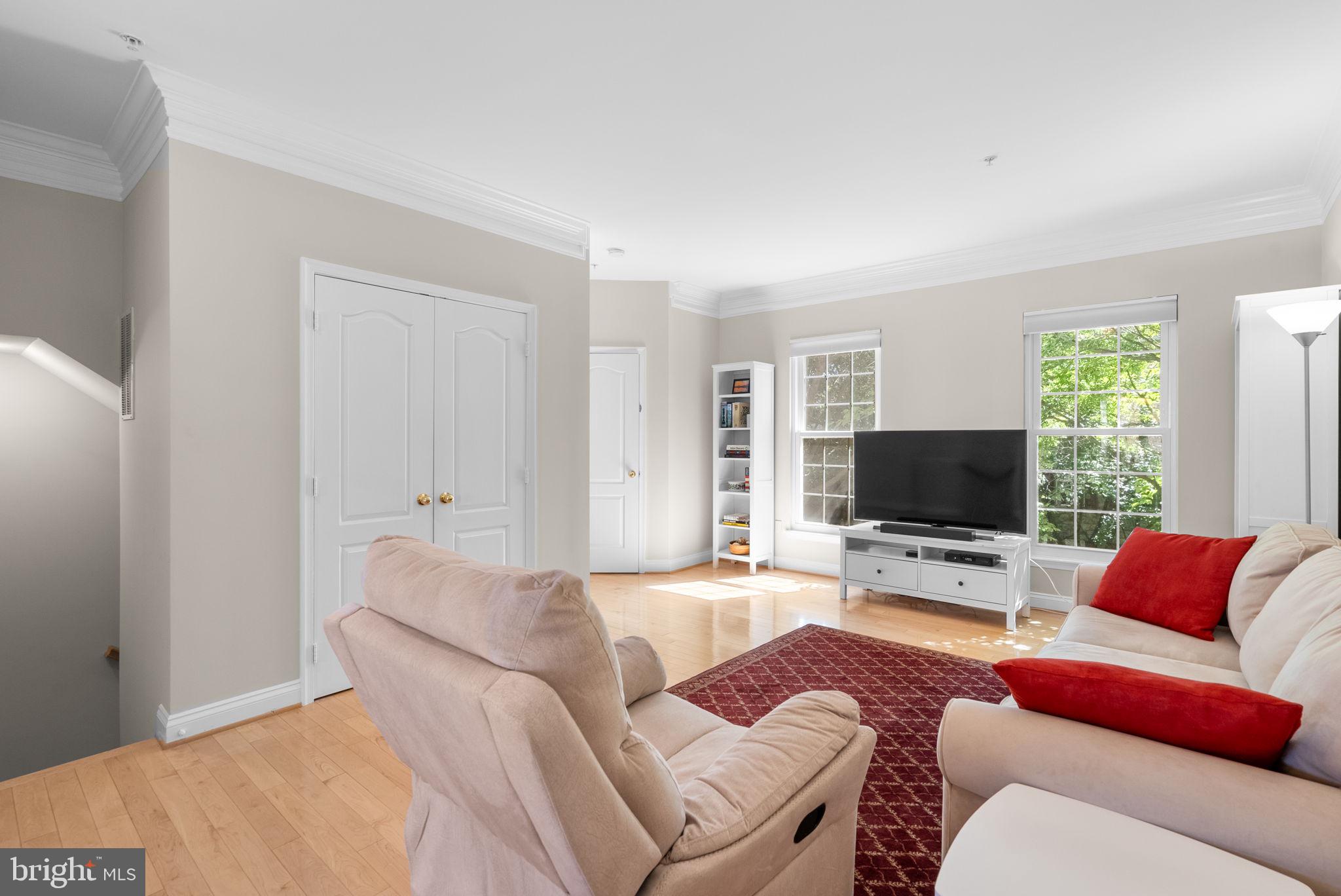 215 Poplar Spring Road Rockville, MD 20850 - Photo 3 of 30 a living room with furniture and a flat screen tv