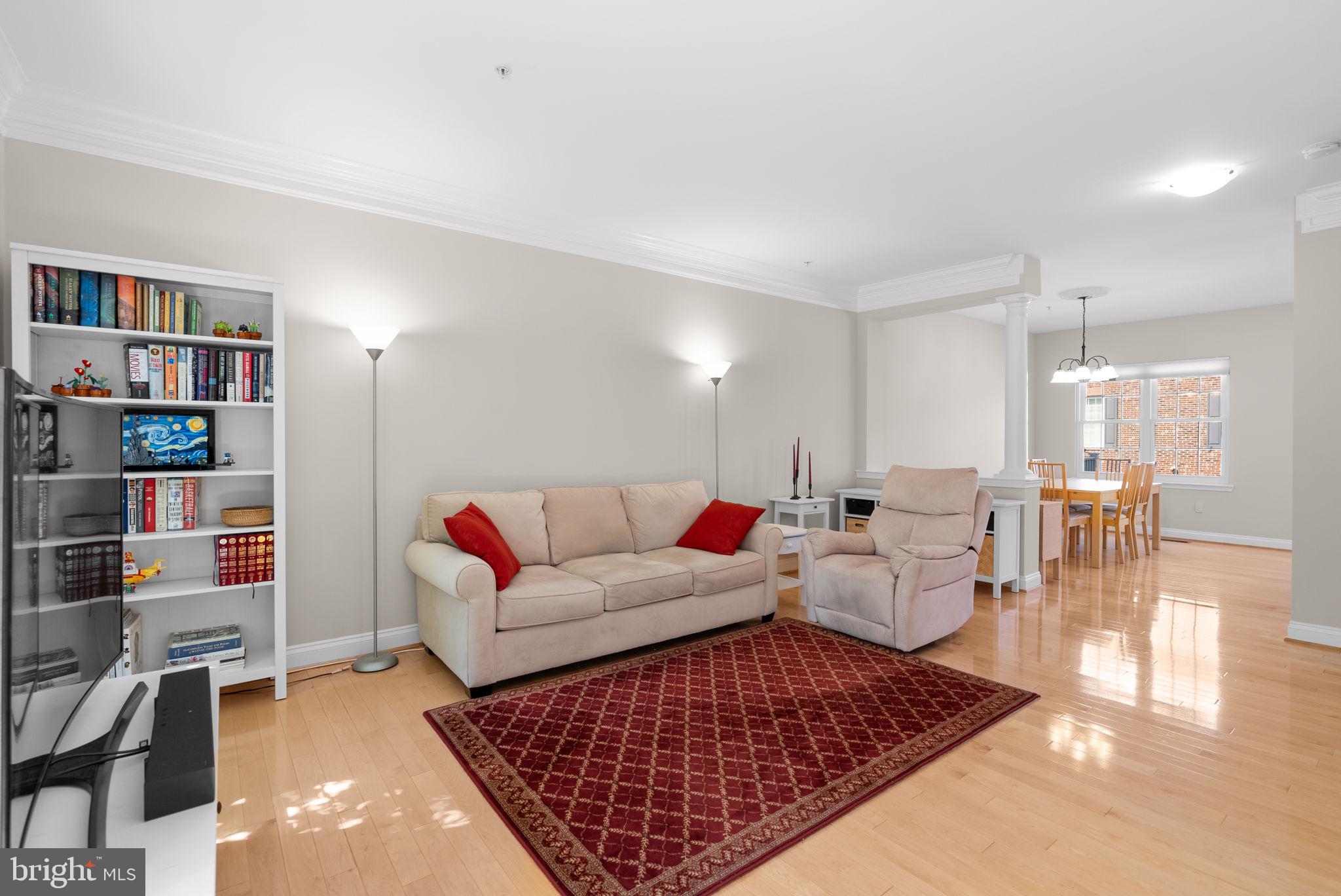 215 Poplar Spring Road Rockville, MD 20850 - Photo 4 of 30 a living room with furniture and a book shelf