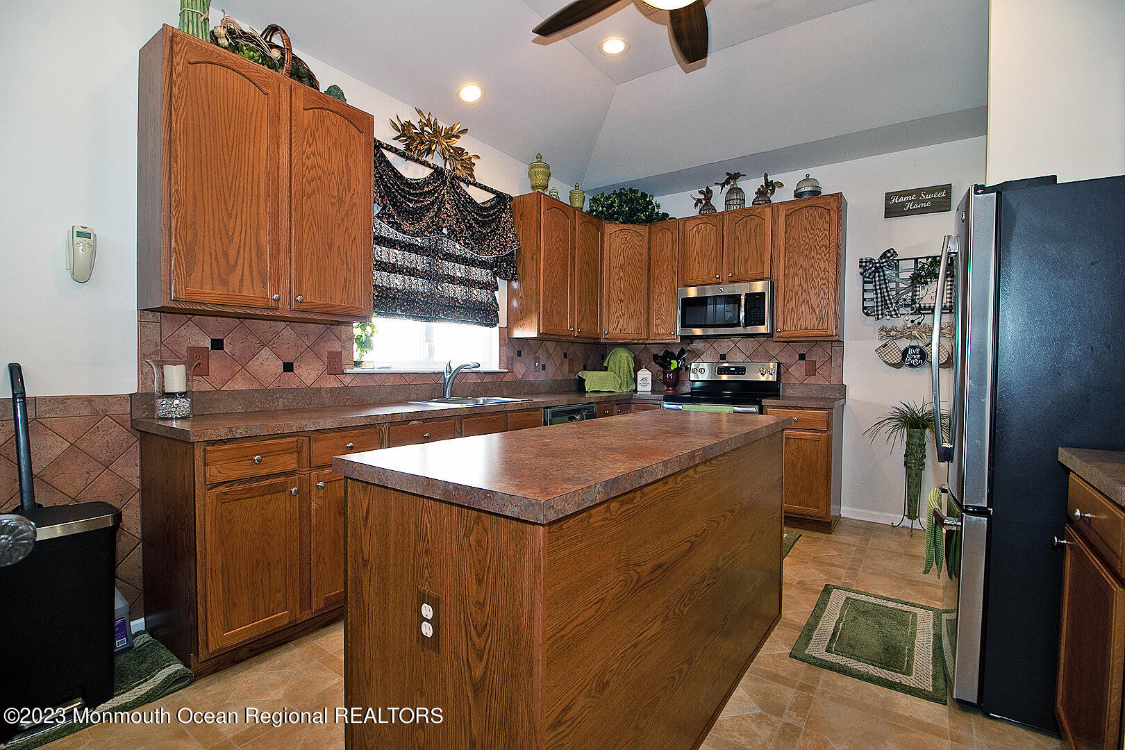 27 Pancoast Road Waretown, NJ 08758 - Photo 17 of 37 a kitchen with kitchen island granite countertop a sink stove and refrigerator