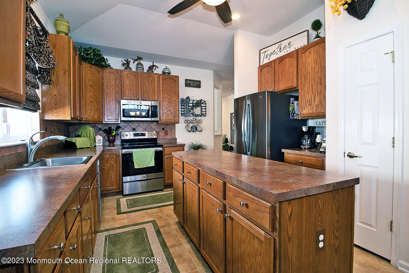 27 Pancoast Road Waretown, NJ 08758 - Photo 20 of 37 a kitchen with stainless steel appliances granite countertop a refrigerator a stove and a sink