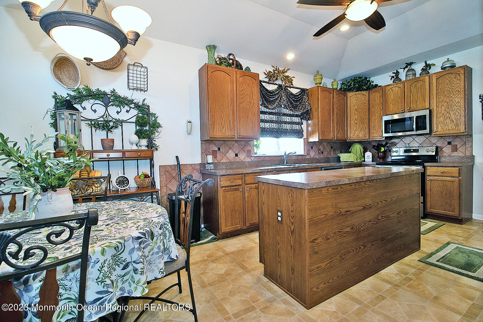 27 Pancoast Road Waretown, NJ 08758 - Photo 21 of 37 a kitchen with cabinets and outdoor seating