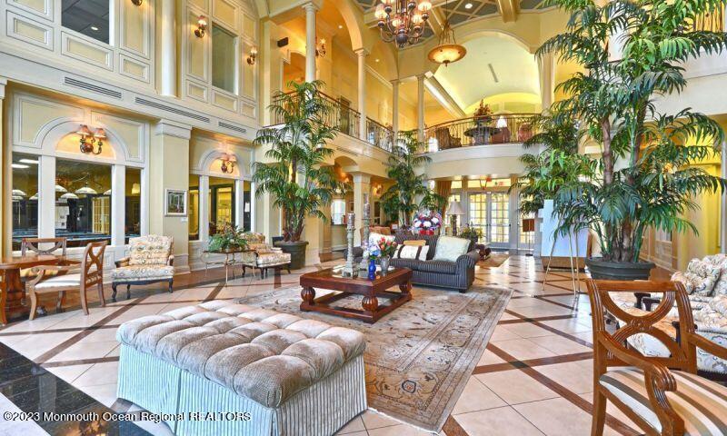 27 Pancoast Road Waretown, NJ 08758 - Photo 34 of 37 a view of a patio with couches table and chairs and potted plants