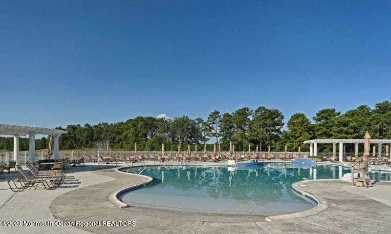 27 Pancoast Road Waretown, NJ 08758 - Photo 36 of 37 a view of a swimming pool with a patio
