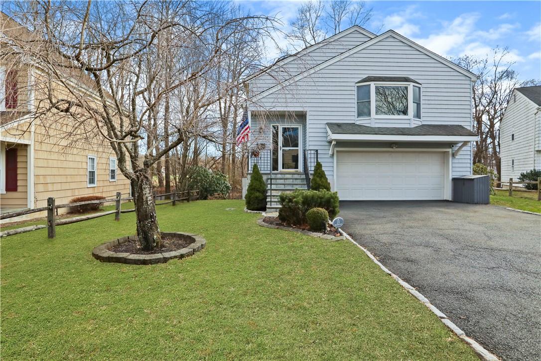 20 Brookside Lane Harrison, NY 10528 - Photo 1 of 1 a front view of a house with a yard and tree