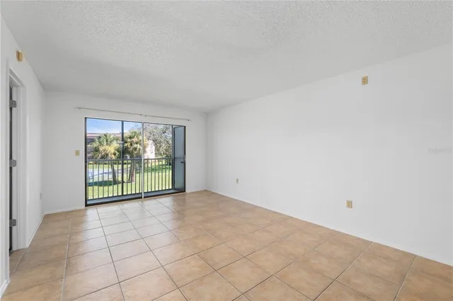 a view of a big room with a kitchen