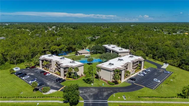 an aerial view of a house with garden space and street view
