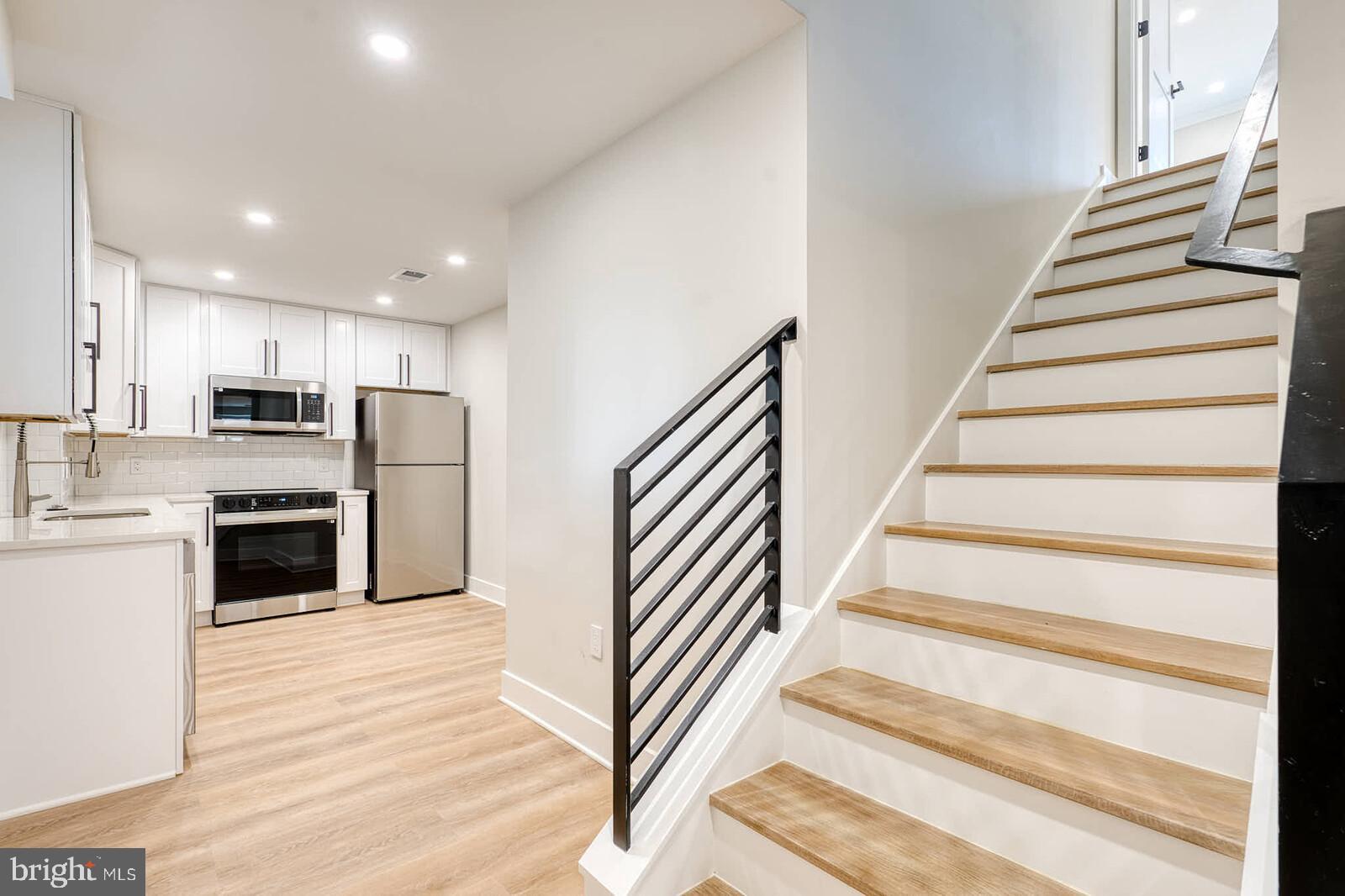 9300 Riggs Road Hyattsville, MD 20783 - Photo 2 of 10 Kitchen / Stairs