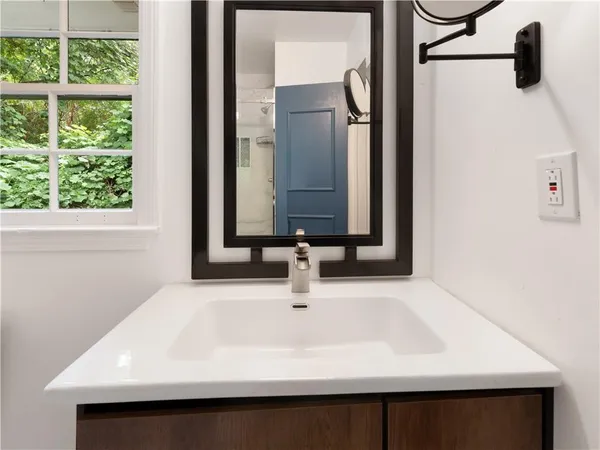 a bathroom with a sink and a mirror
