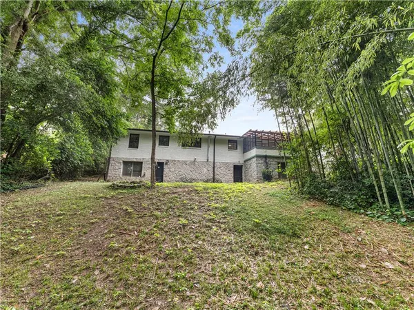 a big house with large trees