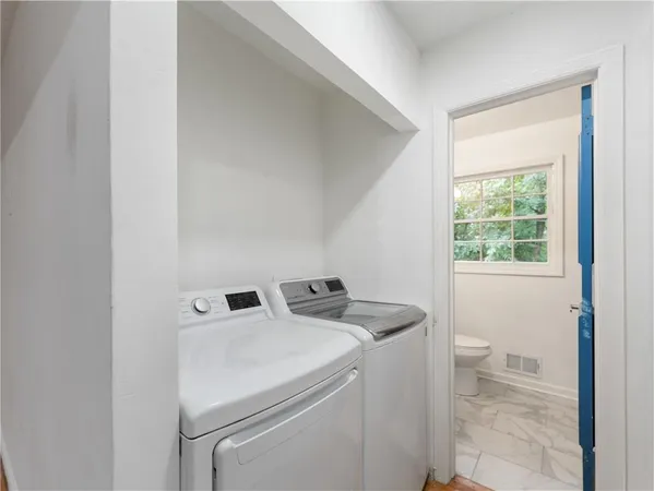 a utility room with dryer and washer
