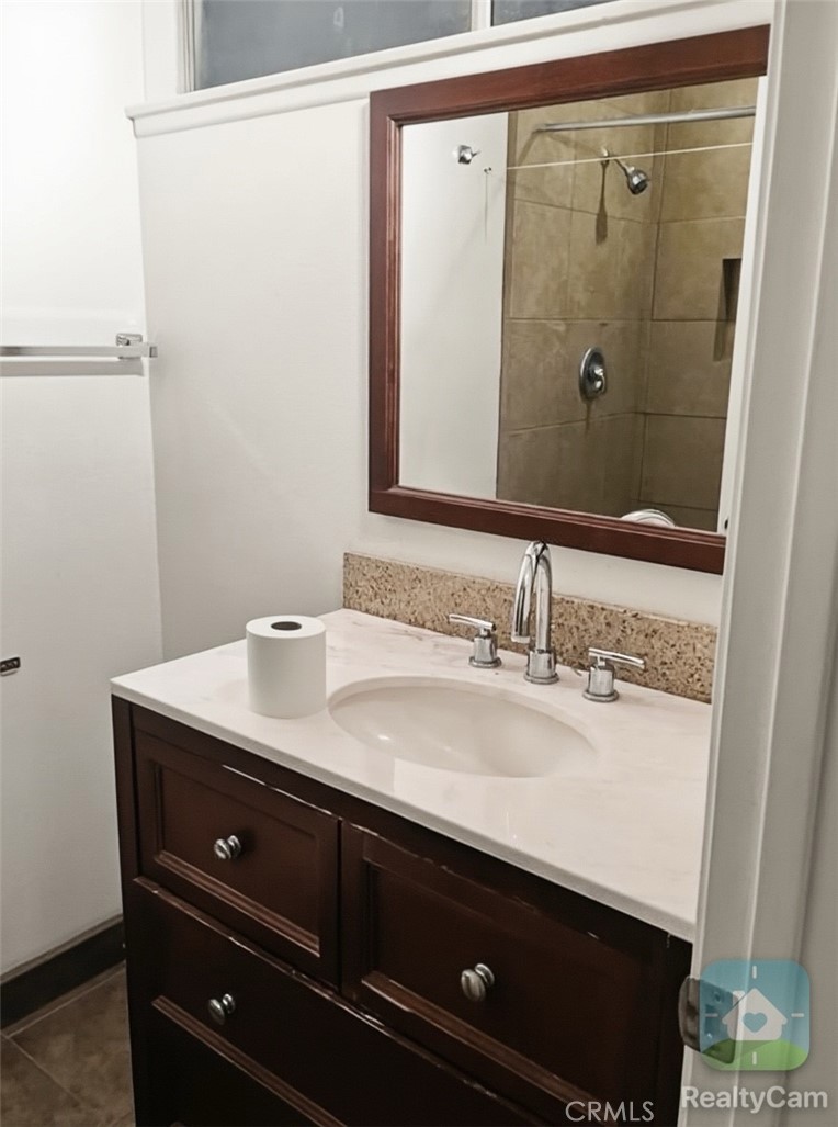 10270 Santa Cruz Road Desert Hot Springs, CA 92240 - Photo 7 of 8 a bathroom with a sink and a mirror