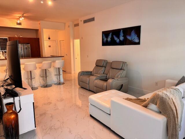 804 East Windward Way, Unit 103 Lantana, FL 33462 - Photo 11 of 29 Living Area toward Kitchen