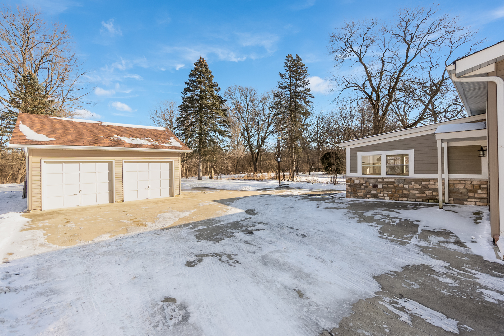 28W418 Batavia Road Warrenville, IL 60555 - Photo 15 of 24 a view of a house with snow on the road