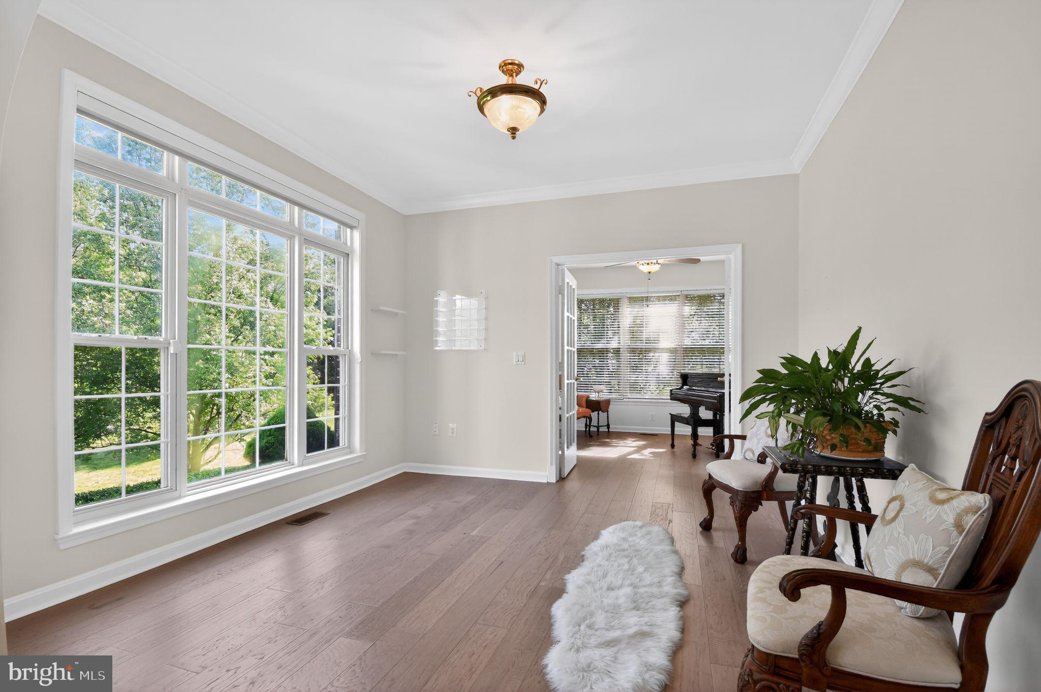 90 Oxford Way Huntingtown, MD 20639 - Photo 11 of 32 a view of a livingroom with furniture window and wooden floor