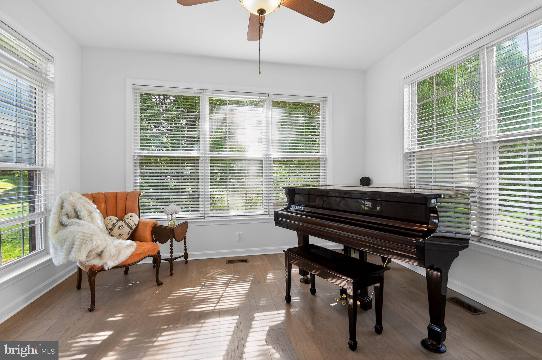 90 Oxford Way Huntingtown, MD 20639 - Photo 13 of 32 a view of a workspace with a window and a couch