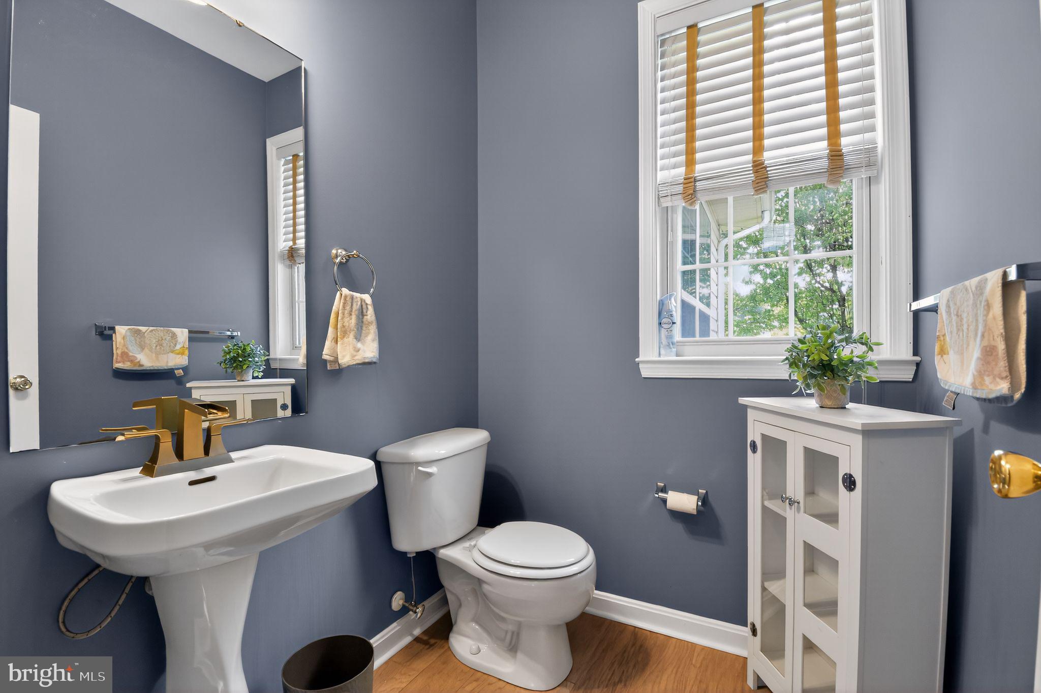 90 Oxford Way Huntingtown, MD 20639 - Photo 17 of 32 a bathroom with a sink toilet and a mirror