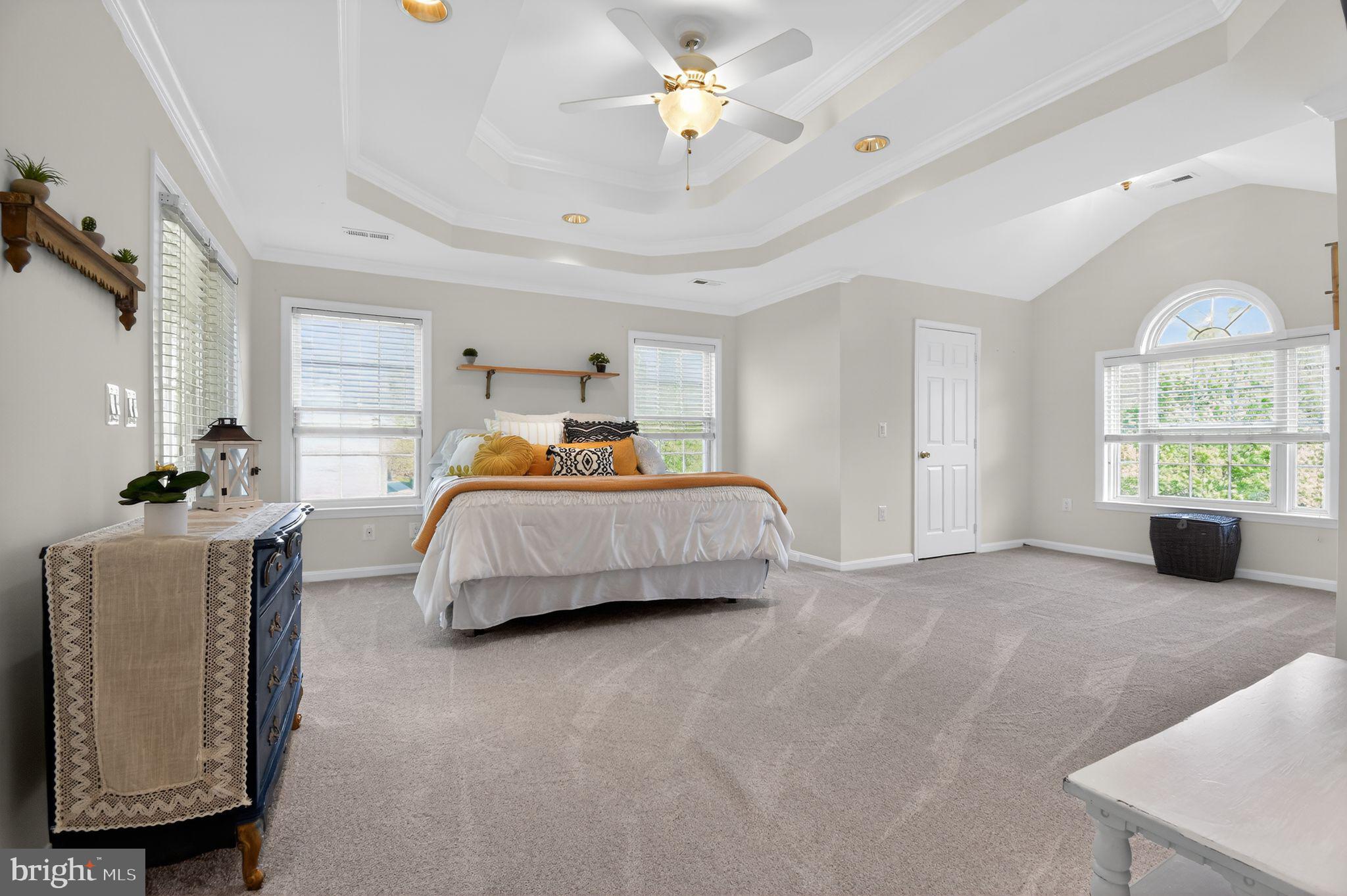 90 Oxford Way Huntingtown, MD 20639 - Photo 19 of 32 a bedroom with a bed and a chandelier