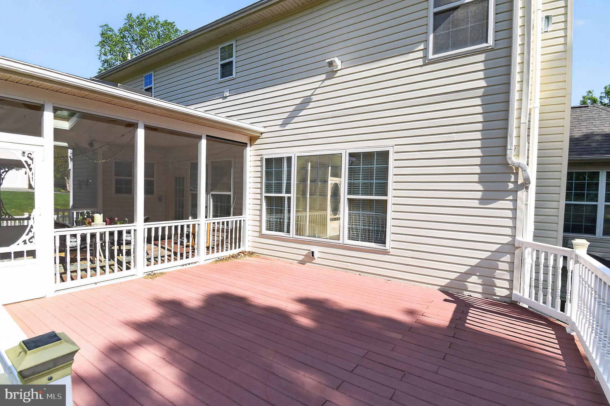 90 Oxford Way Huntingtown, MD 20639 - Photo 6 of 32 a view of a house with wooden deck