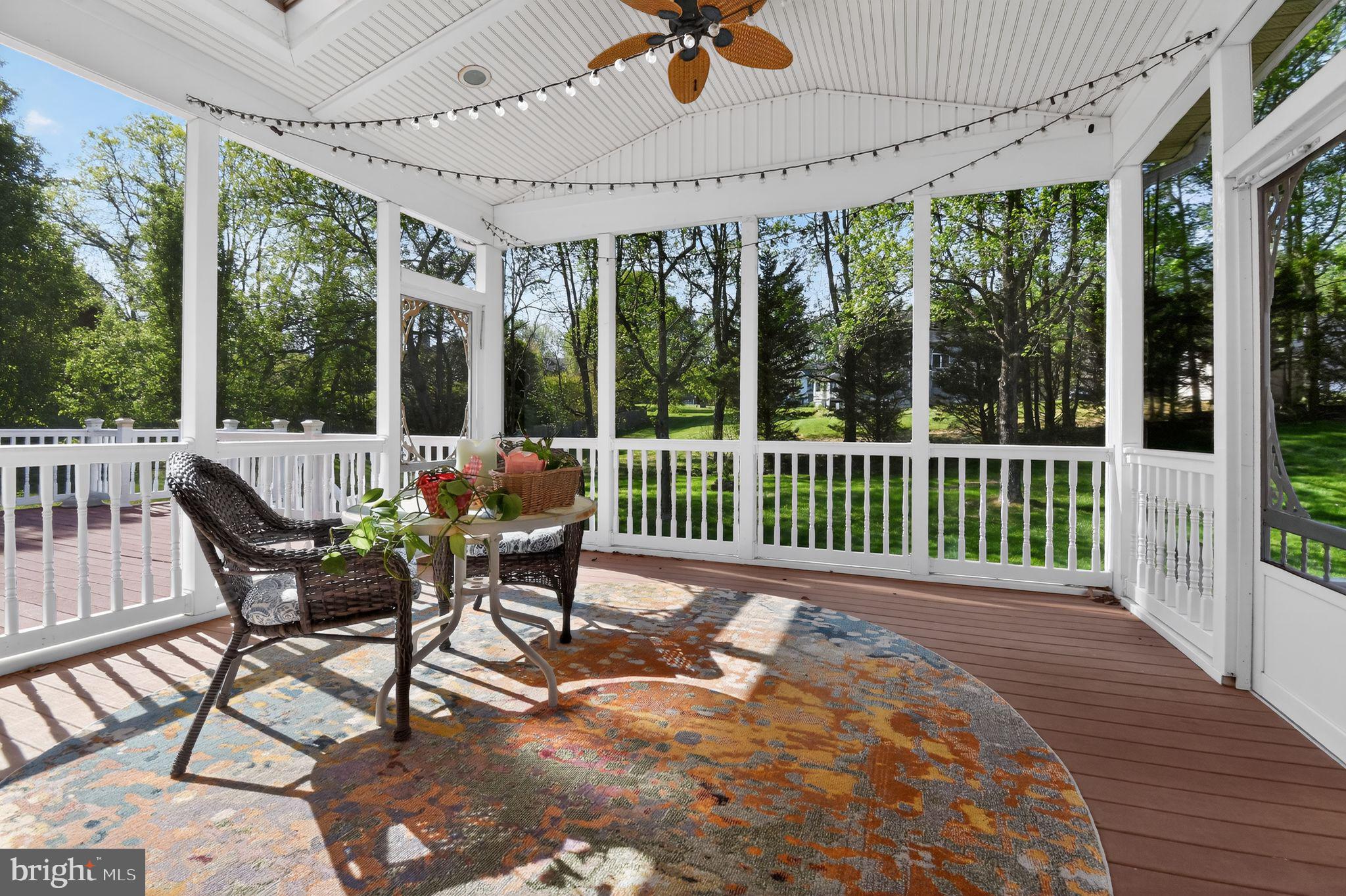 90 Oxford Way Huntingtown, MD 20639 - Photo 7 of 32 a view of a patio with a table chairs and glass door