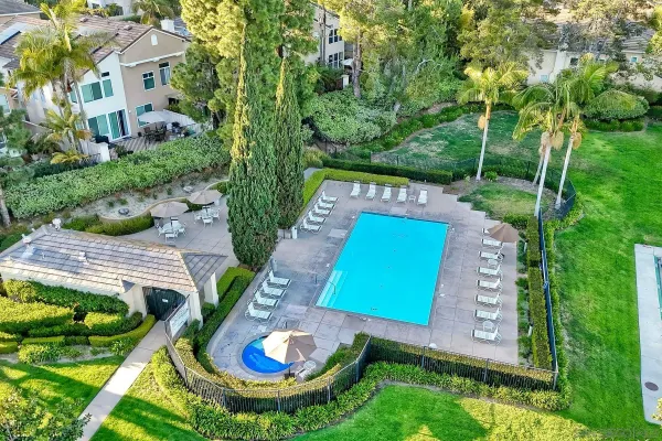 a view of a swimming pool with a yard