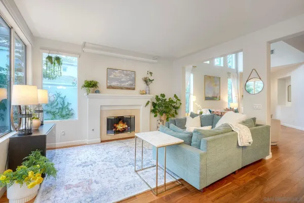 a living room with furniture and a fireplace