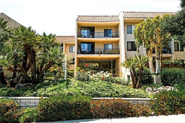 front view of a house with a garden