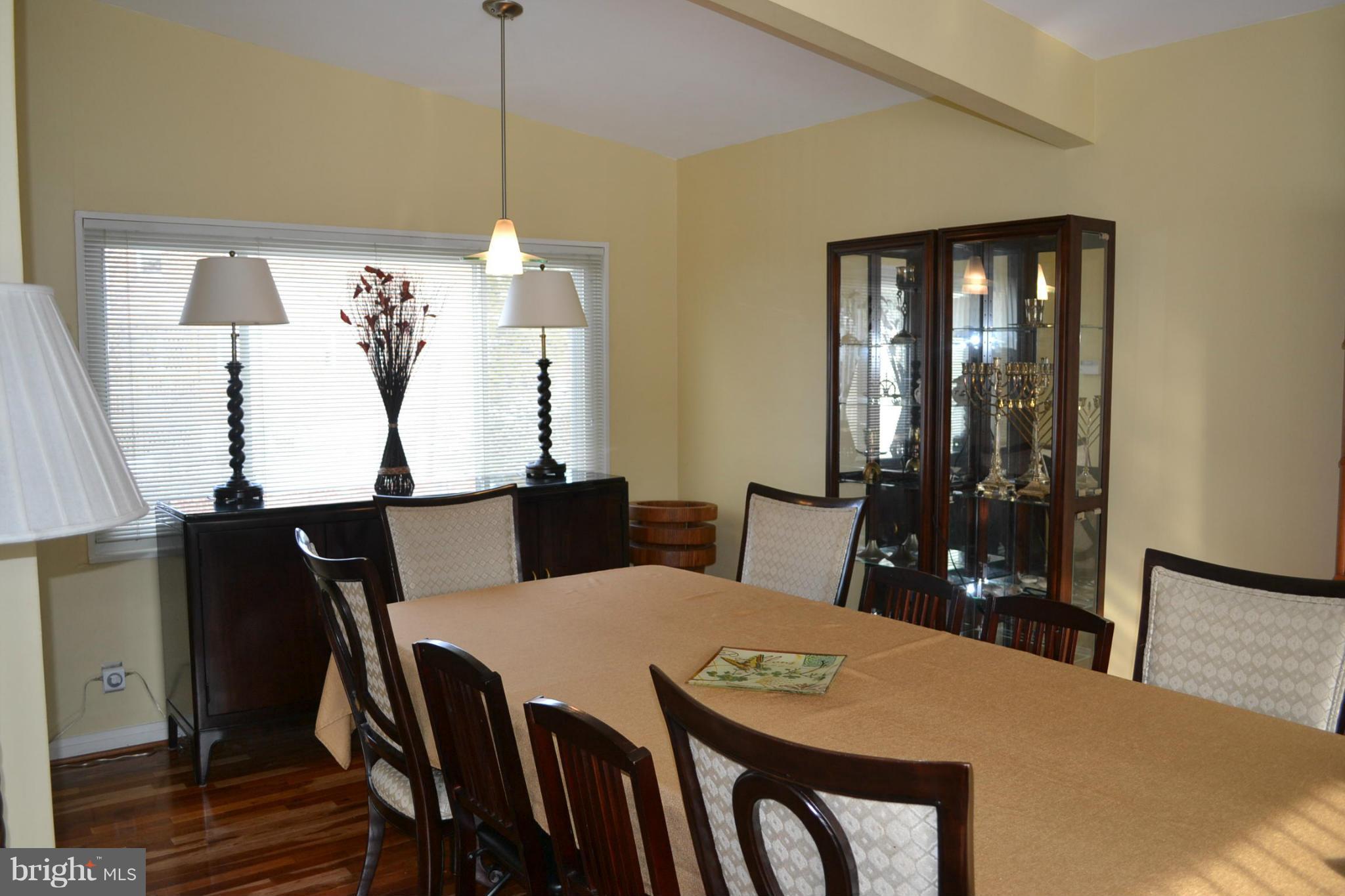 3208 Bonnie Road Baltimore, MD 21208 - Photo 4 of 21 a view of a dining room with furniture window and wooden floor