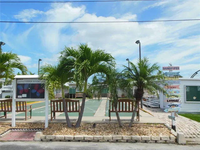 a view of houses with outdoor space and parking