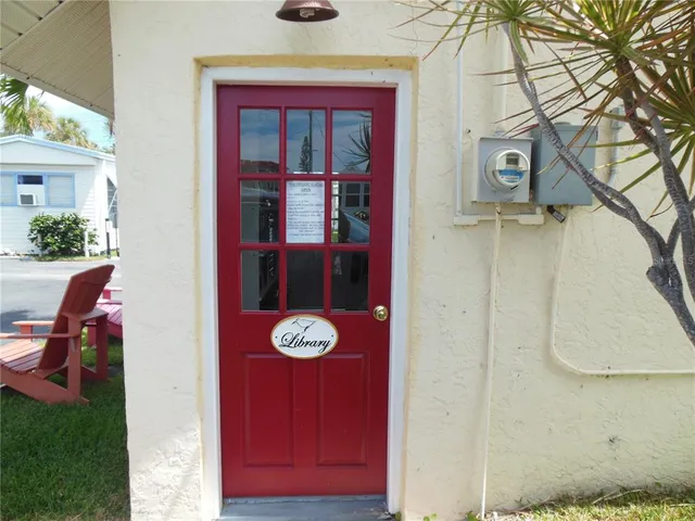 a view of chair and table in the backyard