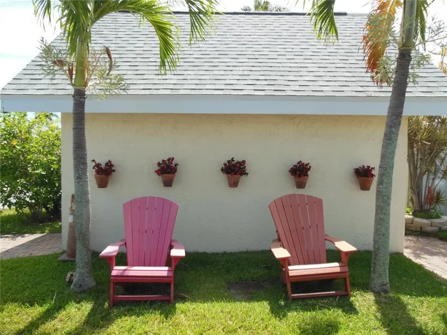 a view of a chairs and table in patio